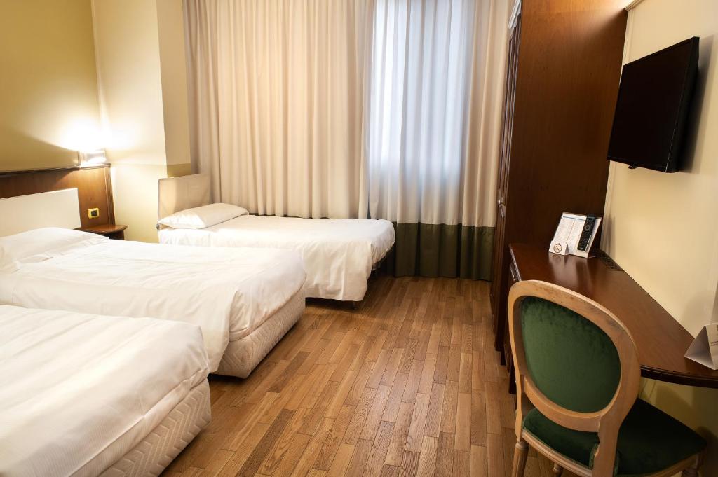 Postel nebo postele na pokoji v ubytování Hotel Alga