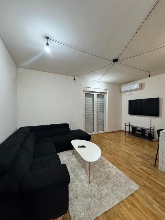 TV a/nebo společenská místnost v ubytování Jednosoban stan Dea