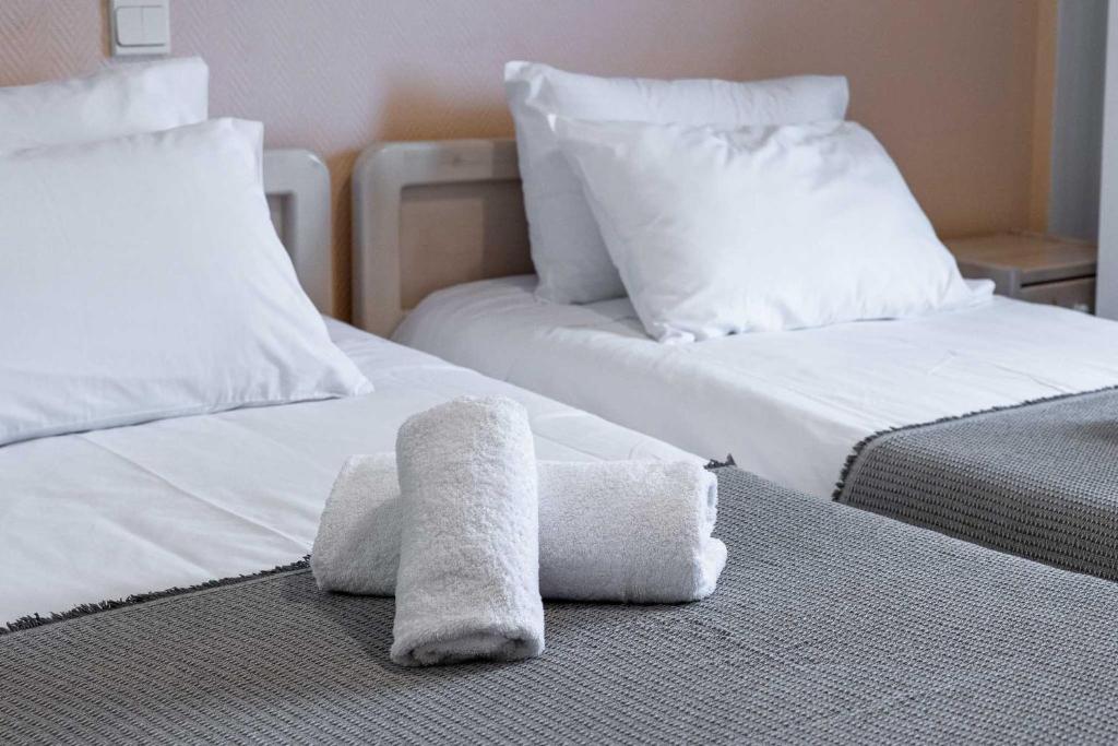 Postel nebo postele na pokoji v ubytování Scala Hotel