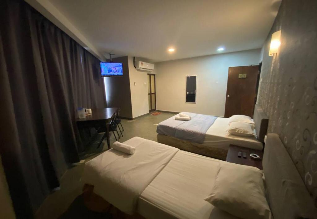 Postel nebo postele na pokoji v ubytování Hotel Harbour Inn