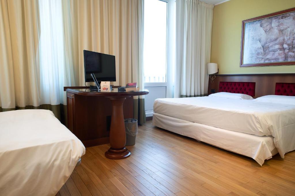 Postel nebo postele na pokoji v ubytování Hotel Alga