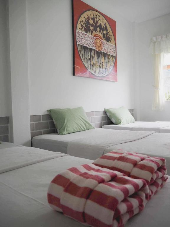 Postel nebo postele na pokoji v ubytování Wara Pool Villa Sam Roi Yot