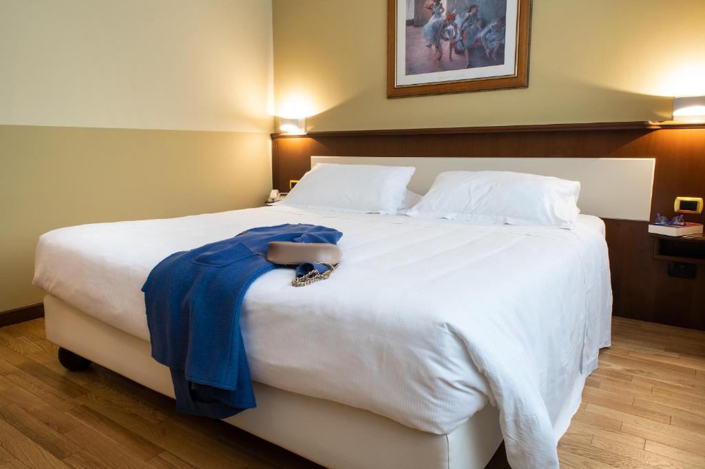 Postel nebo postele na pokoji v ubytování Hotel Alga