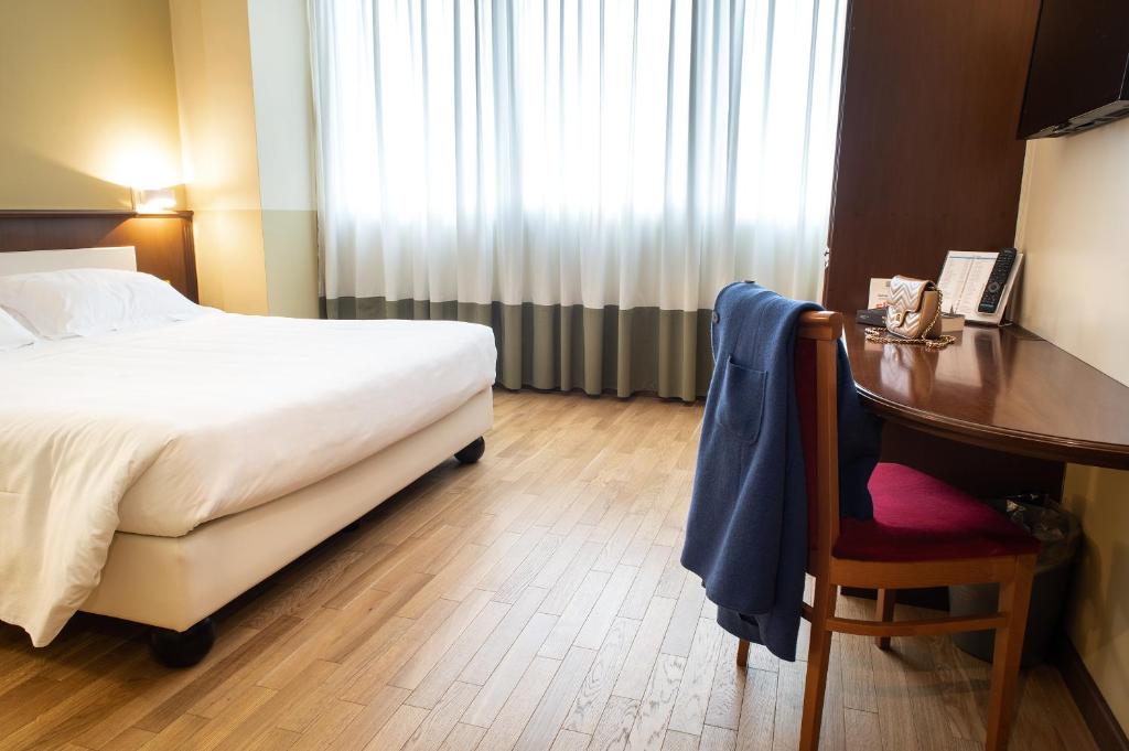 Postel nebo postele na pokoji v ubytování Hotel Alga