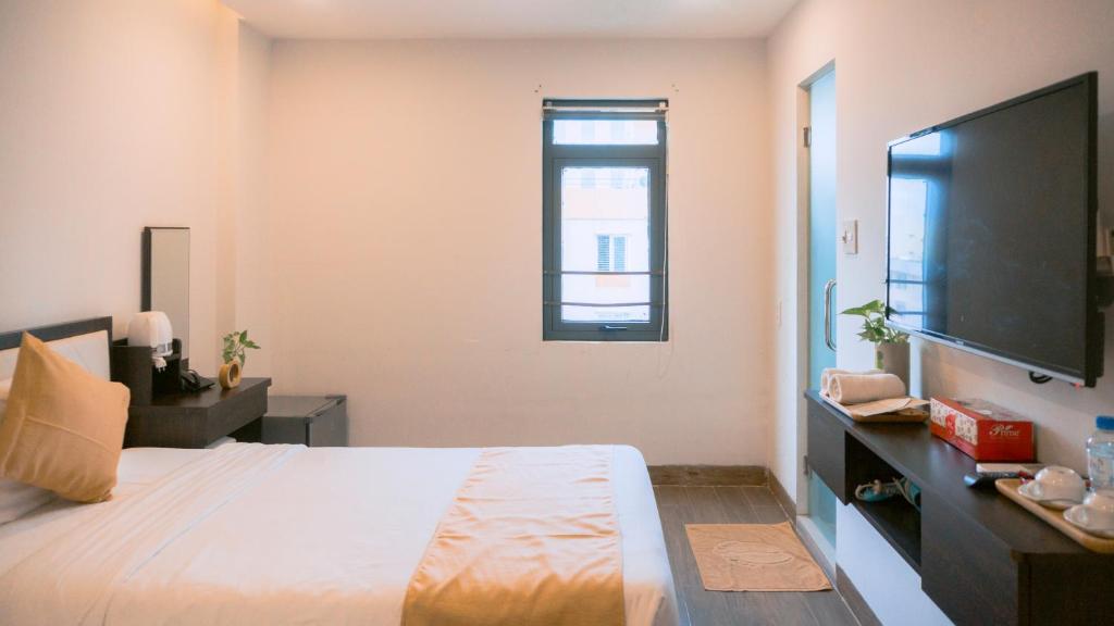 Postel nebo postele na pokoji v ubytování Horizon Front Beach Hotel Danang