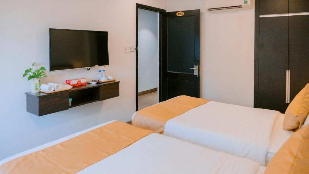 Postel nebo postele na pokoji v ubytování Horizon Front Beach Hotel Danang