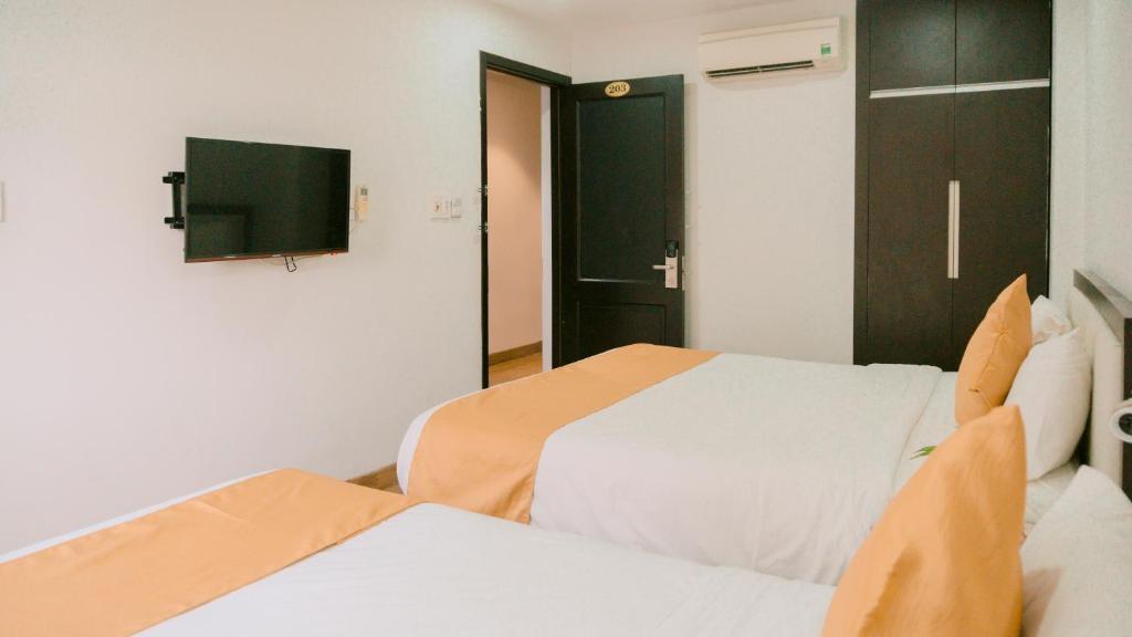 Postel nebo postele na pokoji v ubytování Horizon Front Beach Hotel Danang