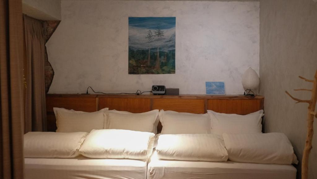 Postel nebo postele na pokoji v ubytování Yu Apartment