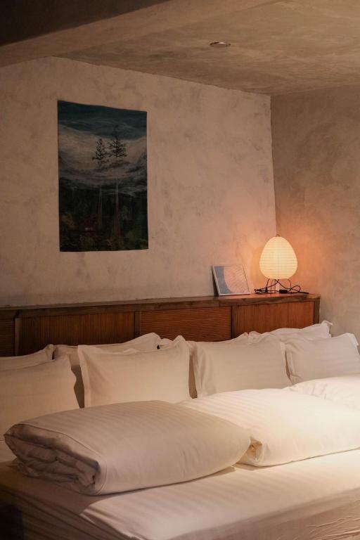 Postel nebo postele na pokoji v ubytování Yu Apartment