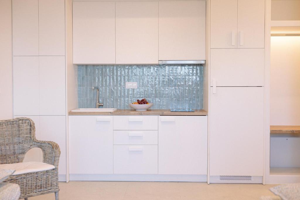 A kitchen or kitchenette at Myrto Homes Lefkada Agios Nikitas Greece