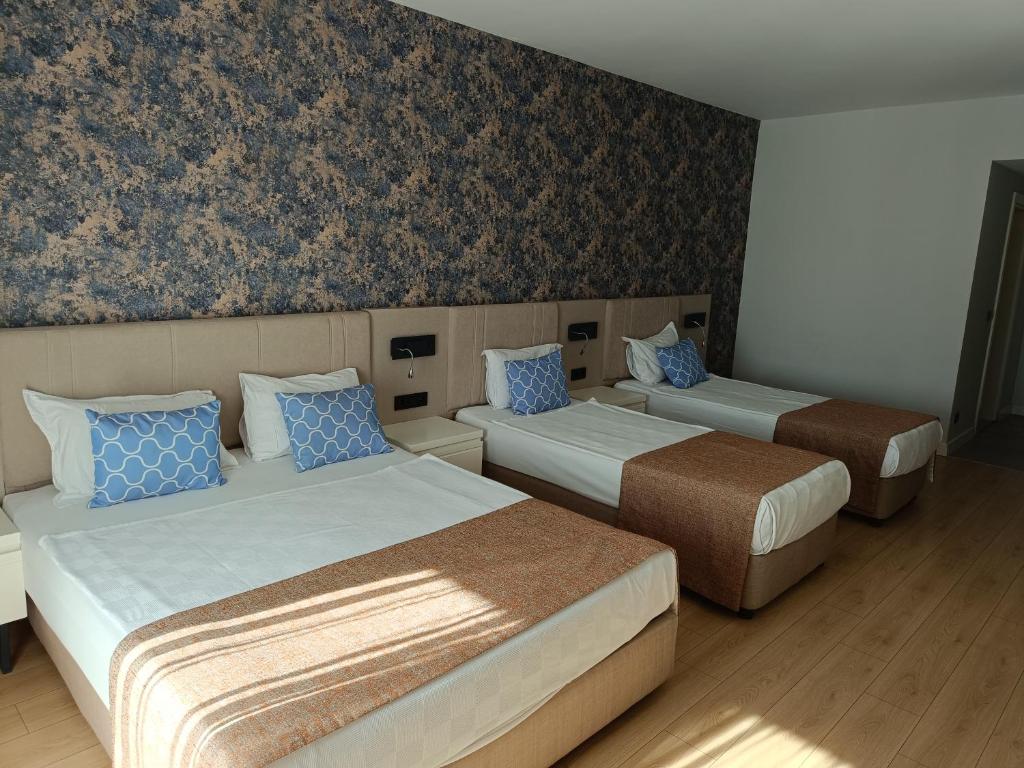 Postel nebo postele na pokoji v ubytování Eldar Garden Resort
