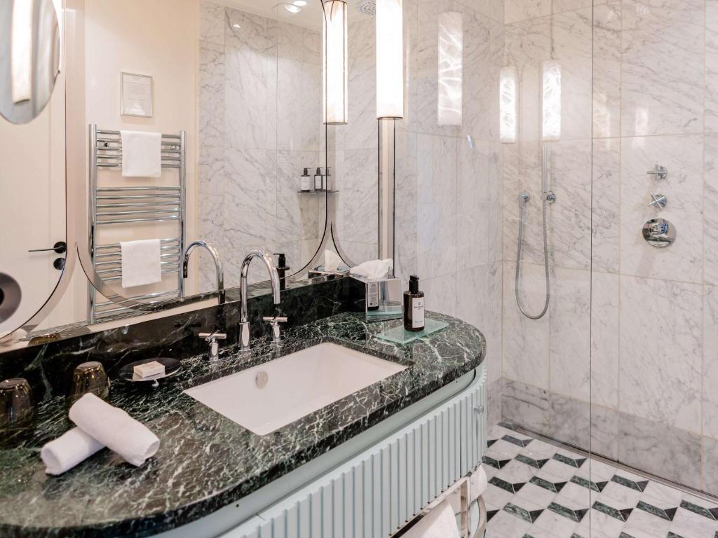 a bathroom with a sink and a shower at Mondrian Cannes in Cannes