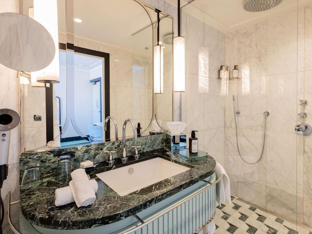 a bathroom with a sink and a shower at Mondrian Cannes in Cannes
