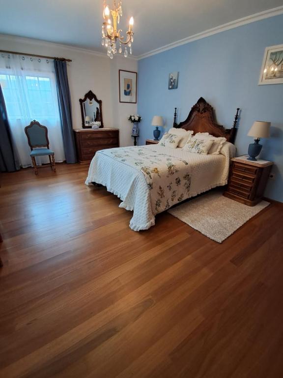 Postel nebo postele na pokoji v ubytování Casa dos Encantos
