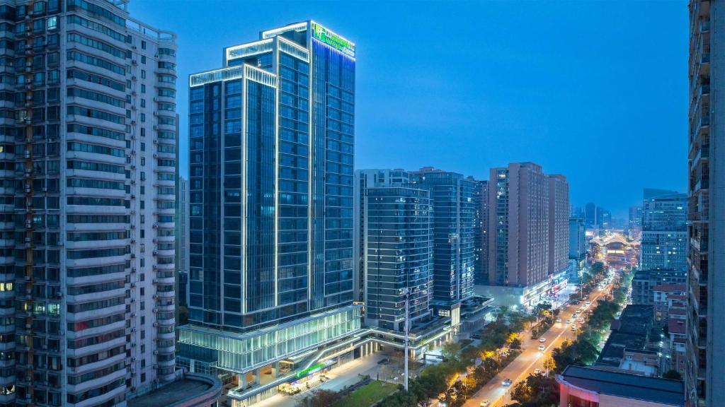 a city skyline with tall buildings and street lights at Holiday Inn Express Wuhan East Lake by IHG in Wuhan