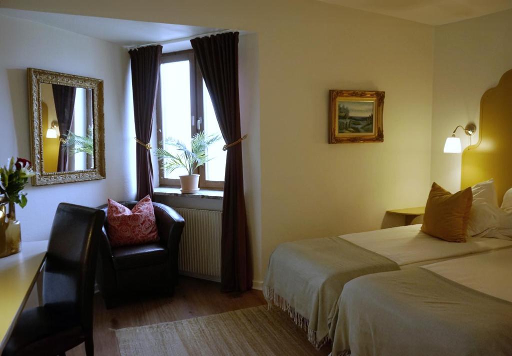 Postel nebo postele na pokoji v ubytování Hotel Lysekil
