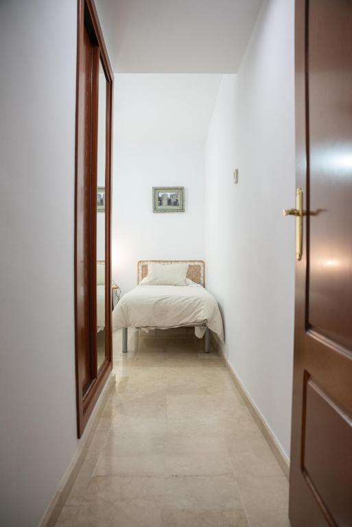 Posteľ alebo postele v izbe v ubytovaní Apartamento Atenea centro con garaje gratuito