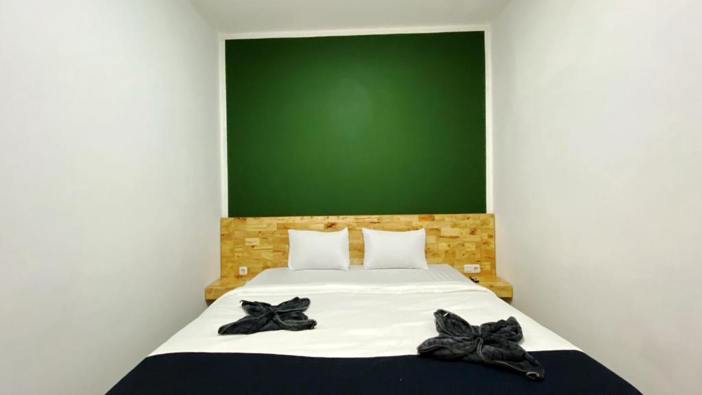 Postel nebo postele na pokoji v ubytování D'Hills Hotel
