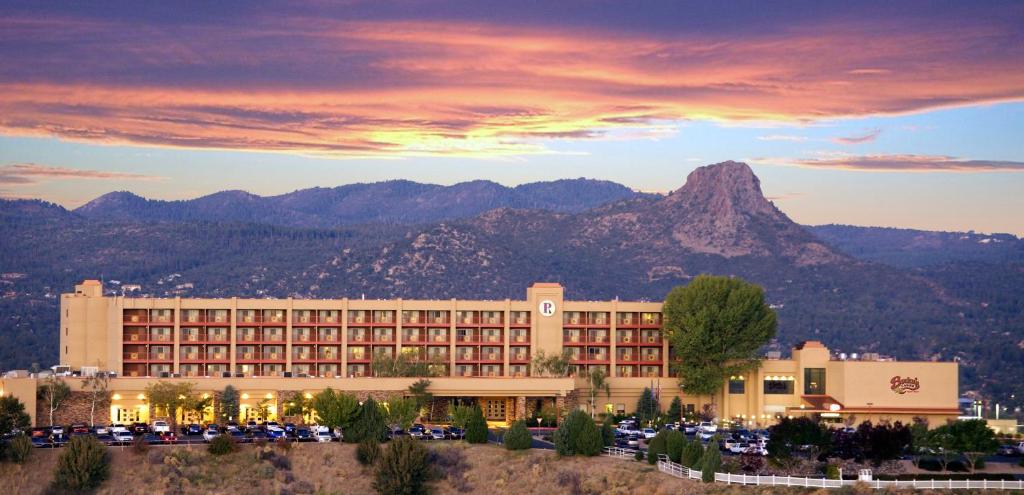 a hotel with a mountain in the background at Prescott Resort & Conference Center in Prescott