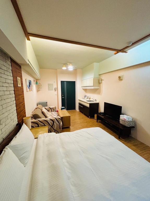Postel nebo postele na pokoji v ubytování Qing Tang Hot Spring B&B