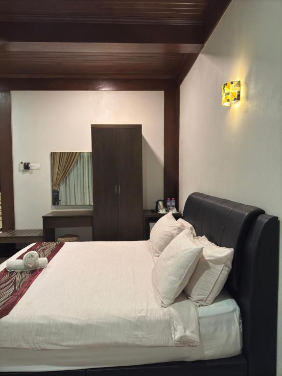 Postel nebo postele na pokoji v ubytování Singgahsana Villa Langkawi