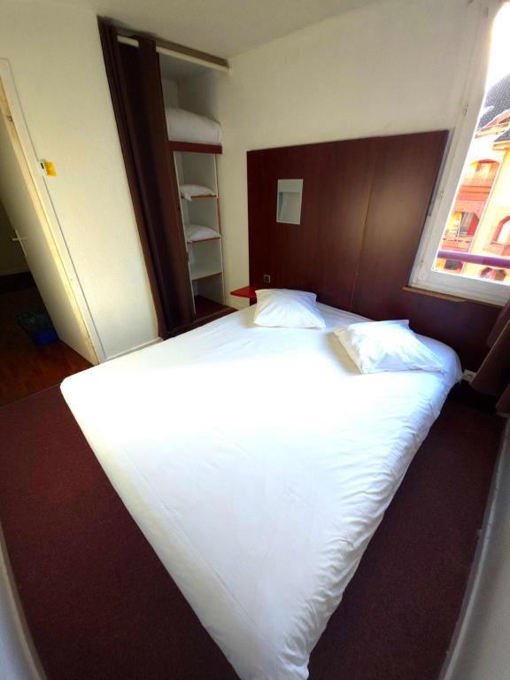 Postel nebo postele na pokoji v ubytování Geneva Residence