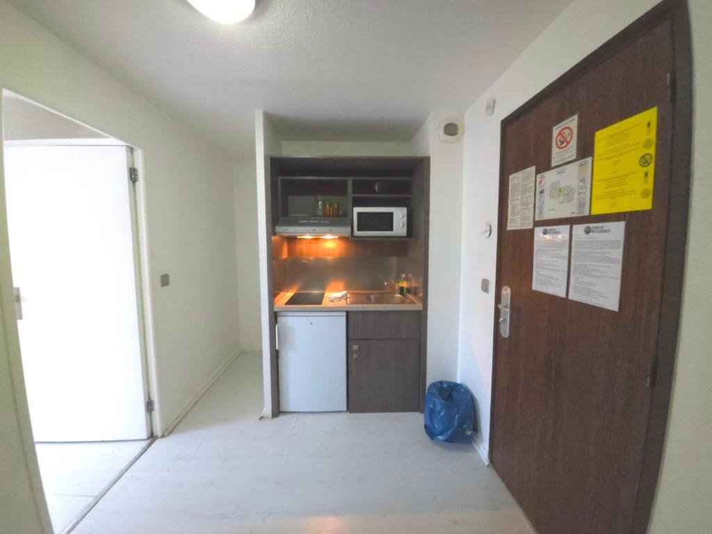 Kuchyň nebo kuchyňský kout v ubytování Geneva Residence