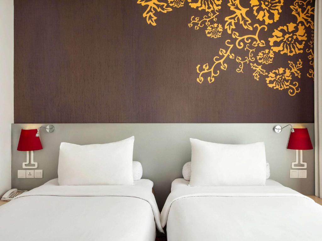 Voodi või voodid majutusasutuse Ibis Styles Malang toas