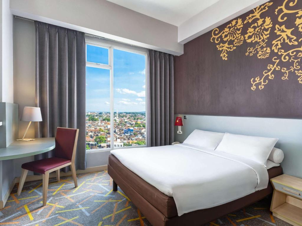 Voodi või voodid majutusasutuse Ibis Styles Malang toas