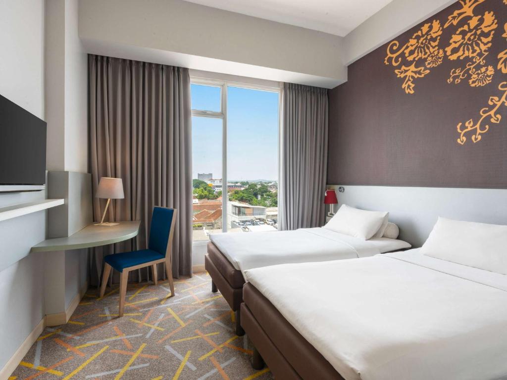Voodi või voodid majutusasutuse Ibis Styles Malang toas