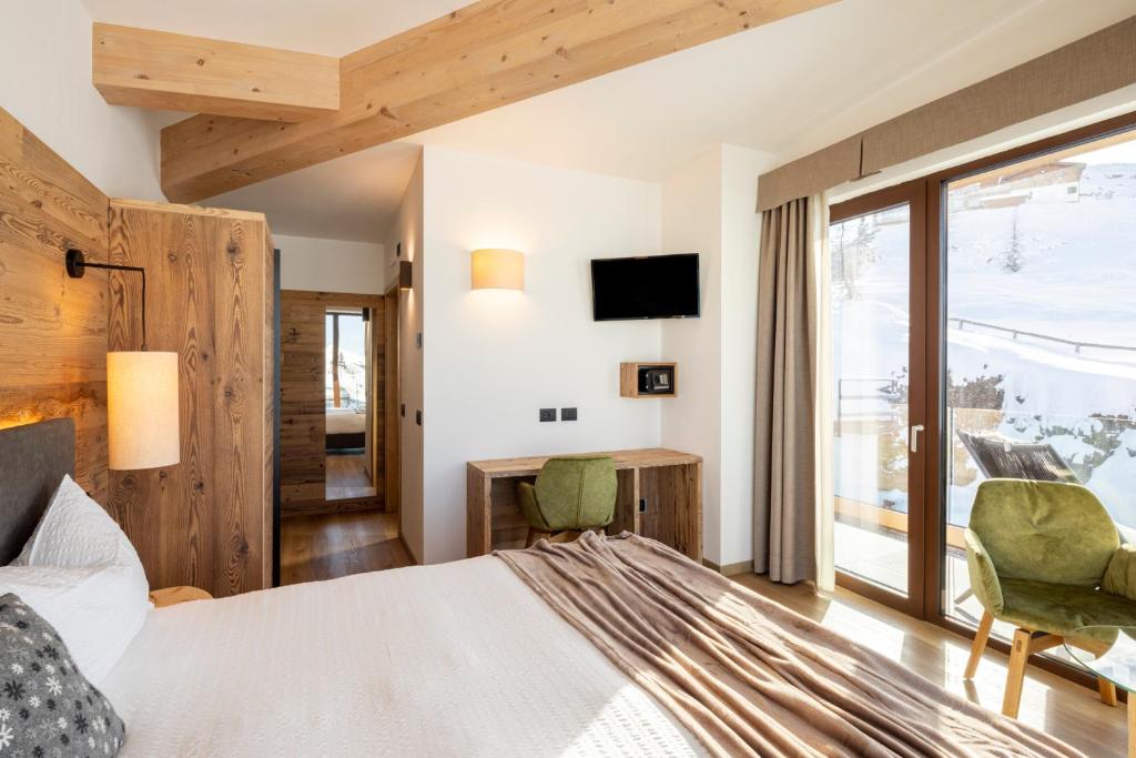 Postel nebo postele na pokoji v ubytování Albergo Vezzana