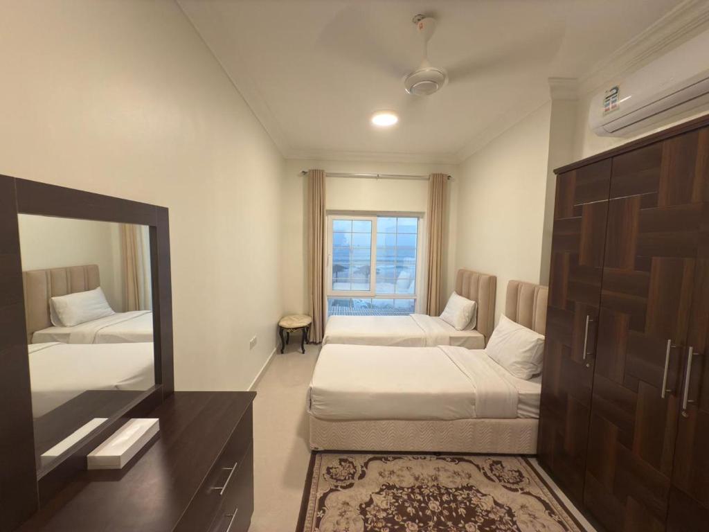 Postel nebo postele na pokoji v ubytování Salalah golden villa