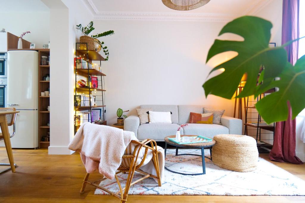 a living room with a couch and a table at Superbe maison quartier Gare Angers 4 personnes in Angers