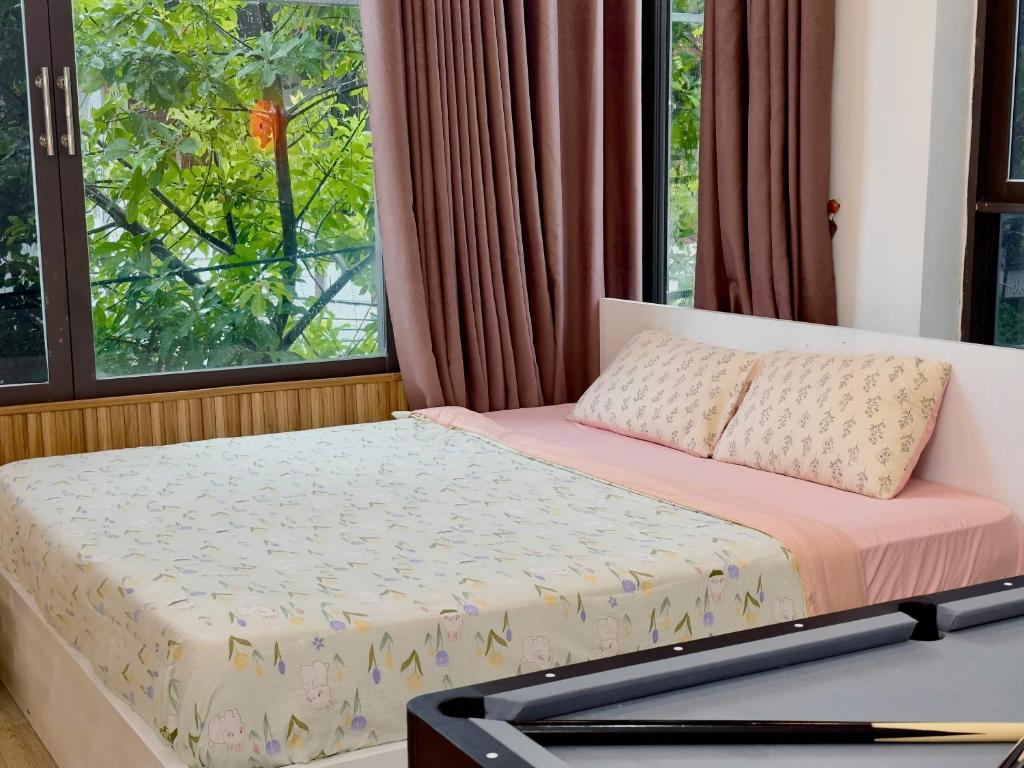 Postel nebo postele na pokoji v ubytování Corgi House Beachstay Danang
