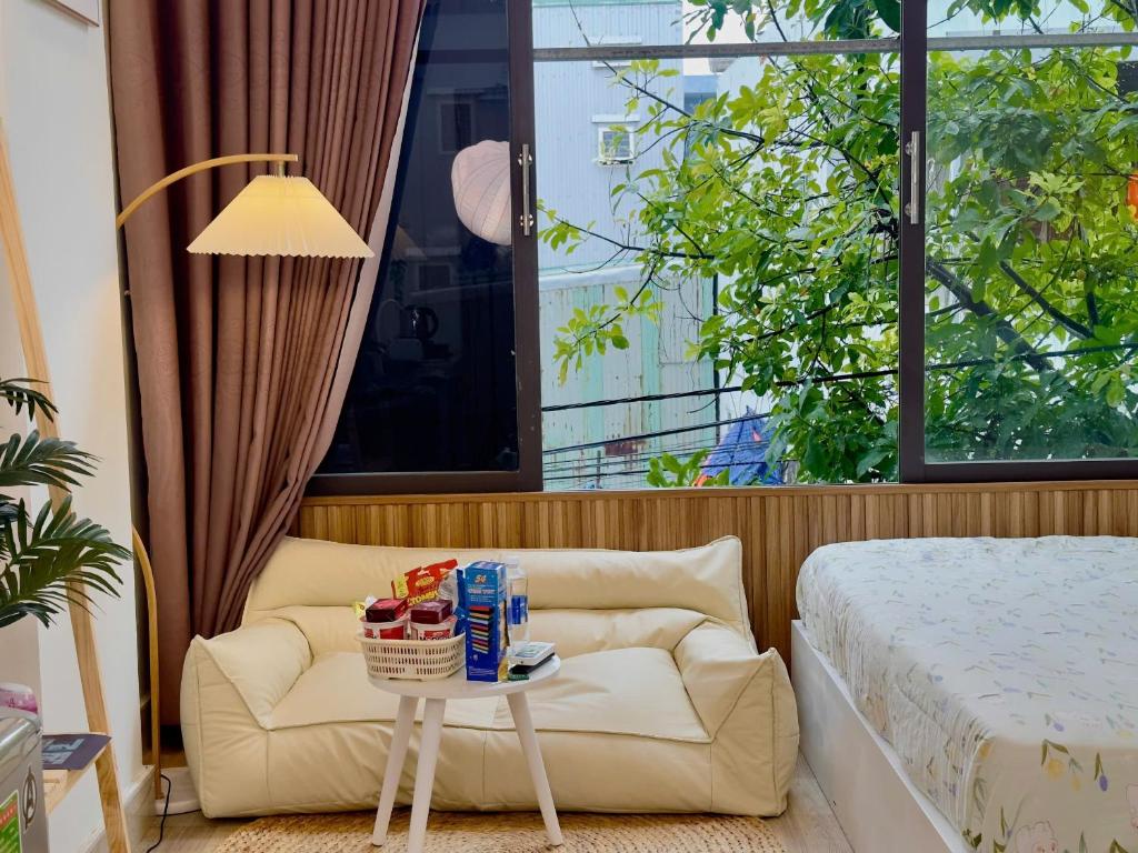 Postel nebo postele na pokoji v ubytování Corgi House Beachstay Danang