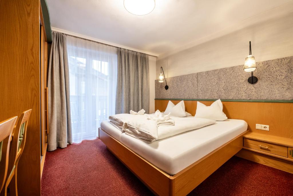 Postel nebo postele na pokoji v ubytování Schnitzl-Eck