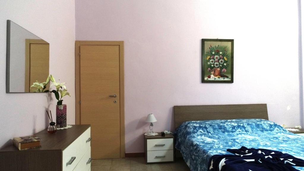 A bed or beds in a room at Appartamento La Chiesetta