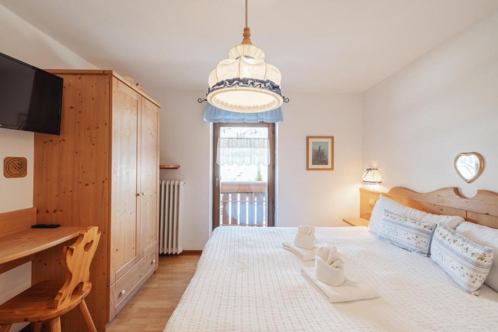 Postel nebo postele na pokoji v ubytování Albergo Vezzana