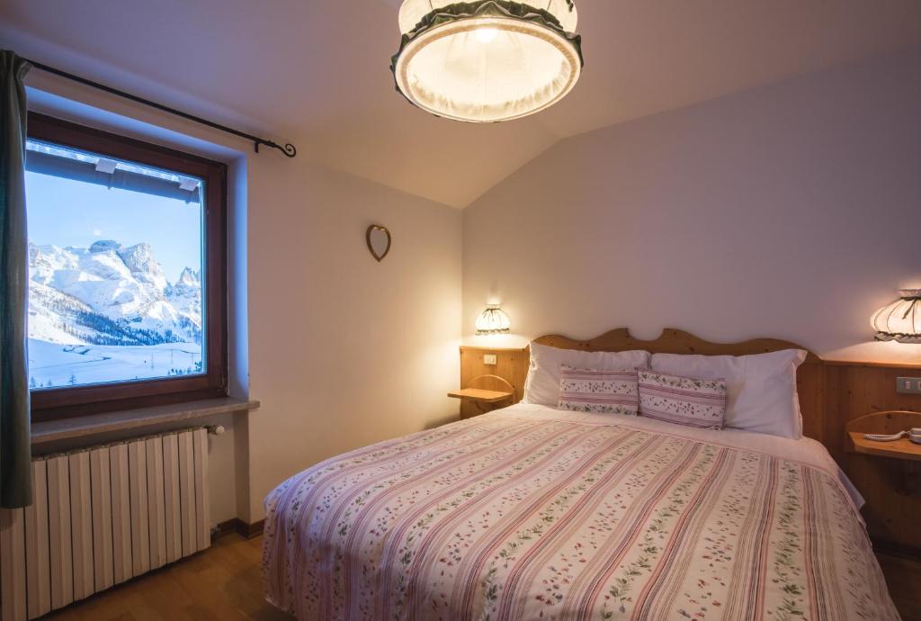 Postel nebo postele na pokoji v ubytování Albergo Vezzana