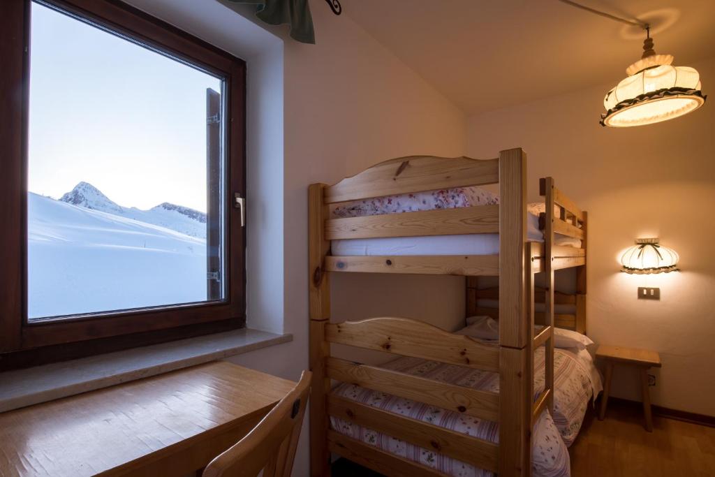 Postel nebo postele na pokoji v ubytování Albergo Vezzana