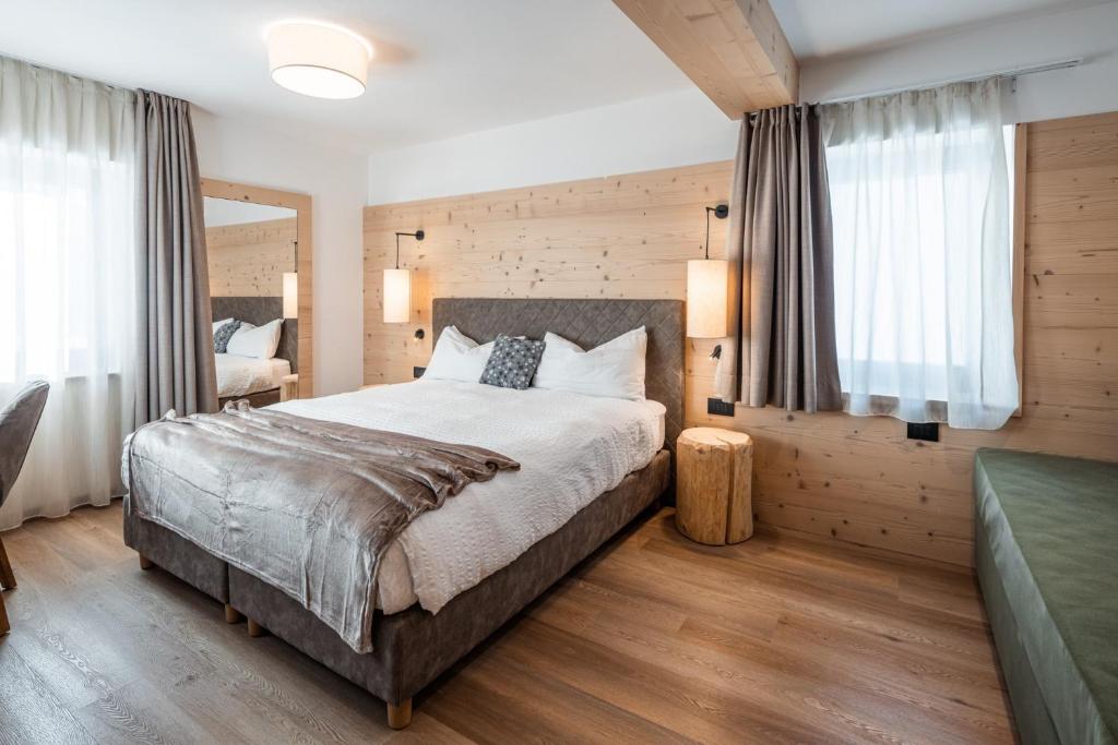 Postel nebo postele na pokoji v ubytování Albergo Vezzana