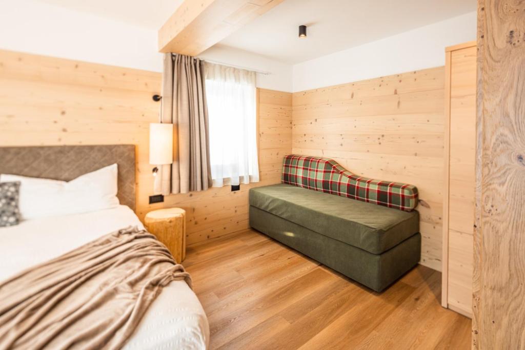 Postel nebo postele na pokoji v ubytování Albergo Vezzana