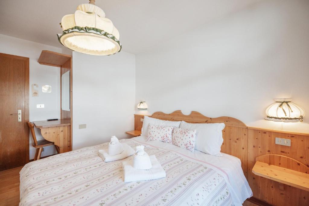 Postel nebo postele na pokoji v ubytování Albergo Vezzana