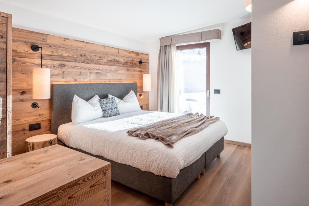 Postel nebo postele na pokoji v ubytování Albergo Vezzana