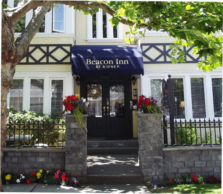 a building with a sign on the front of it at The Beacon Inn at Sidney in Sidney