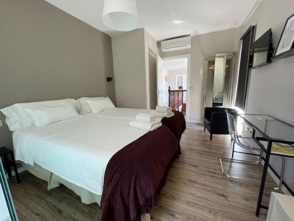 Postel nebo postele na pokoji v ubytování Casa Acougo, Sarria
