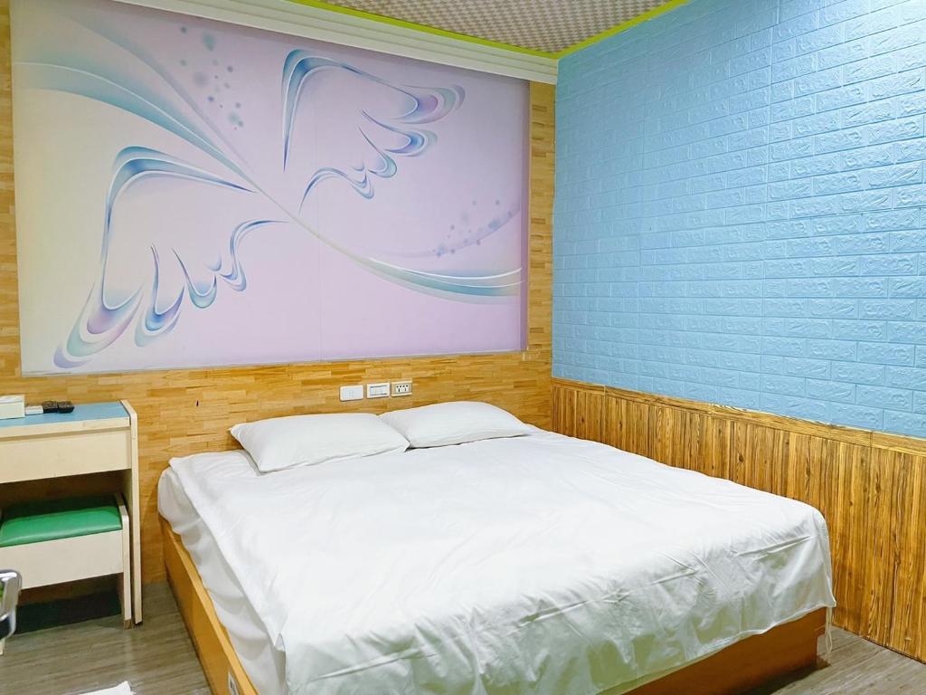 Postel nebo postele na pokoji v ubytování Clover house-自助式無人旅店