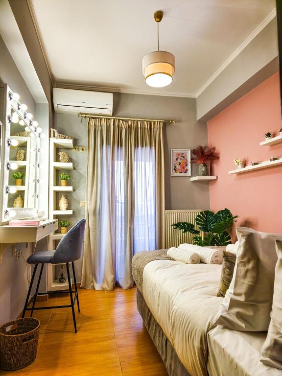 a bedroom with a bed and a chair and a window at Villa Aitheras with sea views and garden in Stérnai