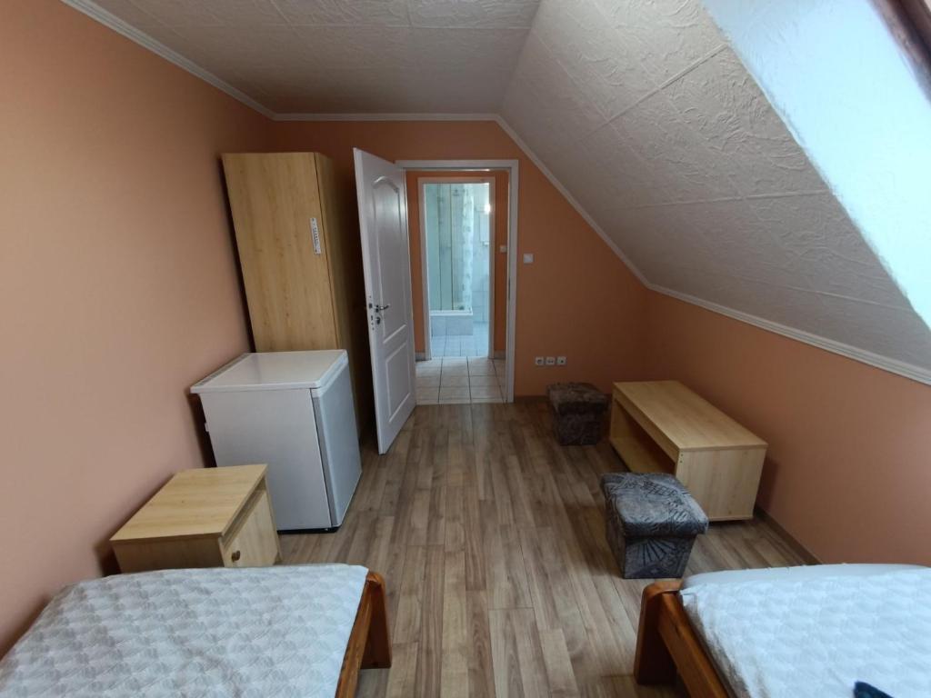 Postel nebo postele na pokoji v ubytování Kettős Csárda Szálláshely Bocfölde