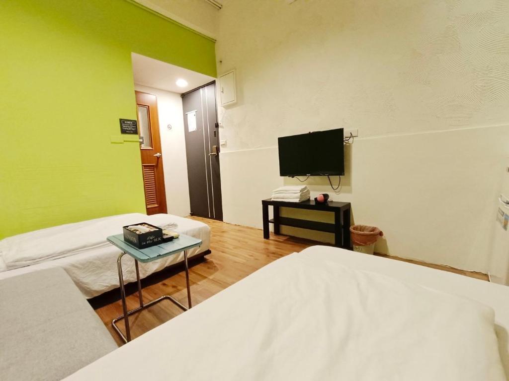 Postel nebo postele na pokoji v ubytování 東海小時光 Tong Hai Time Homestay